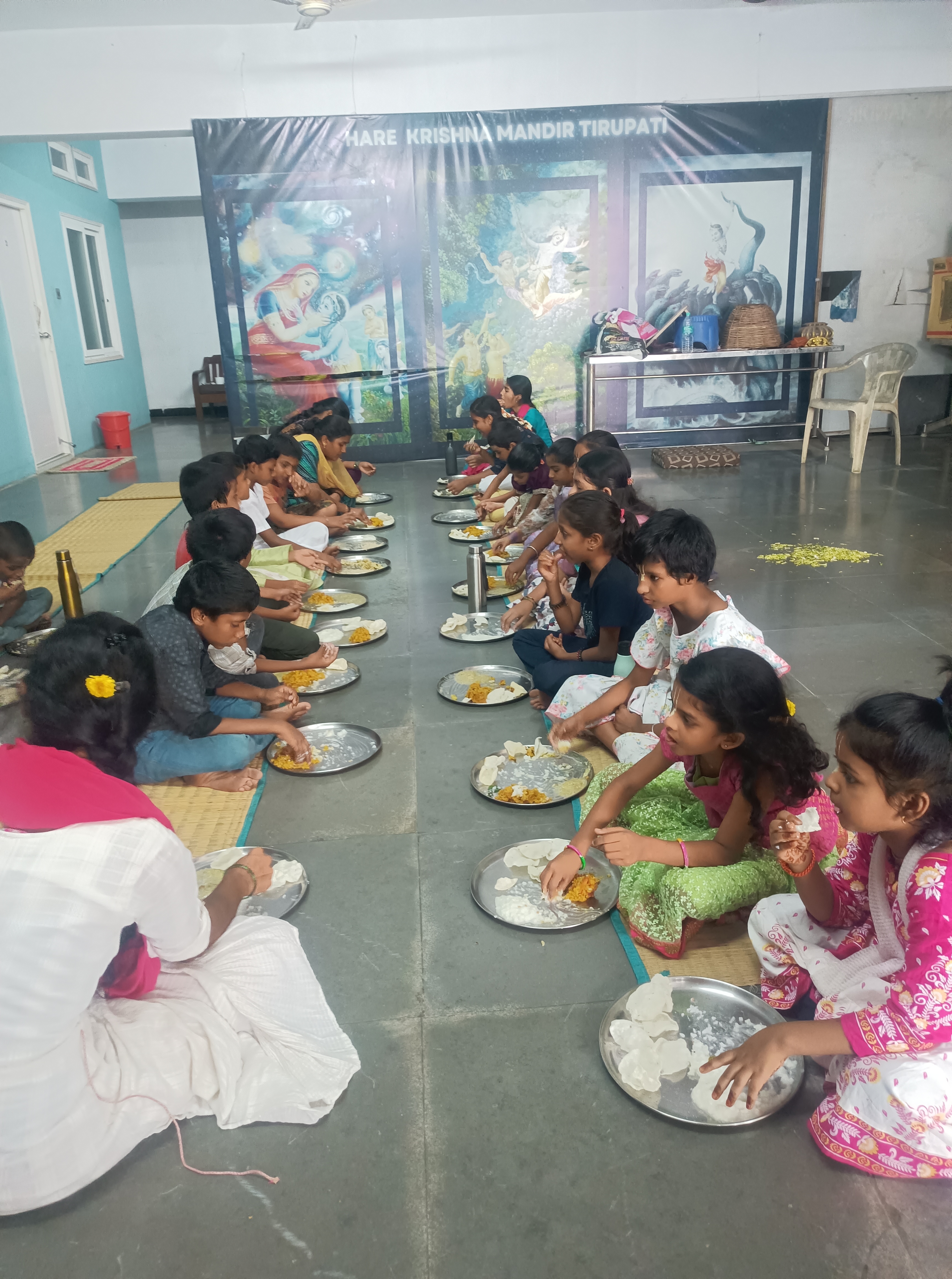 Gurukul children honouring prasadam at Hare Krishna Mandir Tirupati